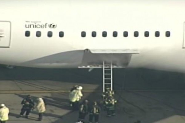 Smoke is seen in the rear cargo door of the Japan Airlines Boeing 787. (Screengrab from WHDH video)