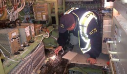 An NTSB investigator examines damage in the Japan Airlines Boeing 787 that caught fire on Monday. (Photo by NTSB)