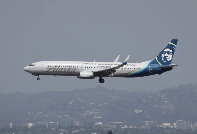 An Alaska Airlines 737 wearing a special livery descends on LAX, as seen from the H Overlook